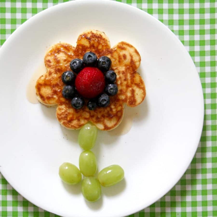 spring flower pancake with fresh fruit and syrup