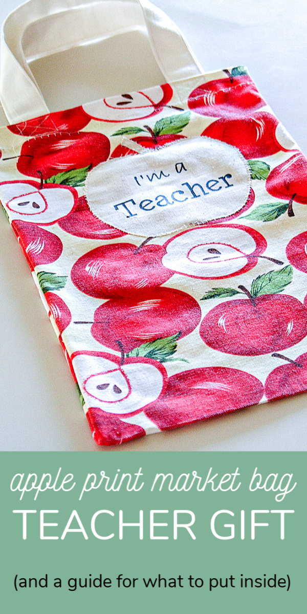 An apple print market tote bag for teachers including a guide for what to put into the bag