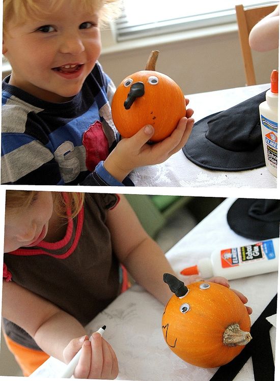 toddlers decorating pumpkins and turning them into witches
