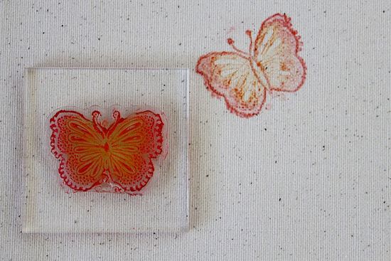a clear butterfly stamp on a stampers block
