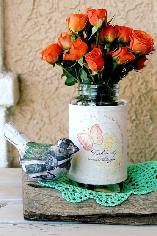 a stamped fabric vase cover filled with flowers