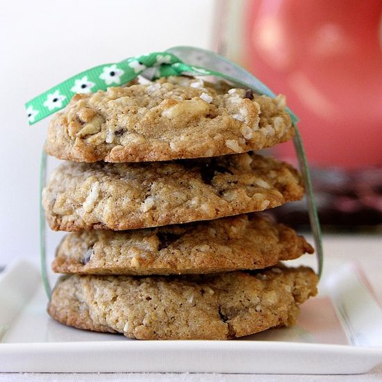 walnut chocolate chip cookies stacked on a plate