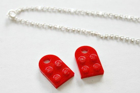 a chain and red lego pieces to make a necklace