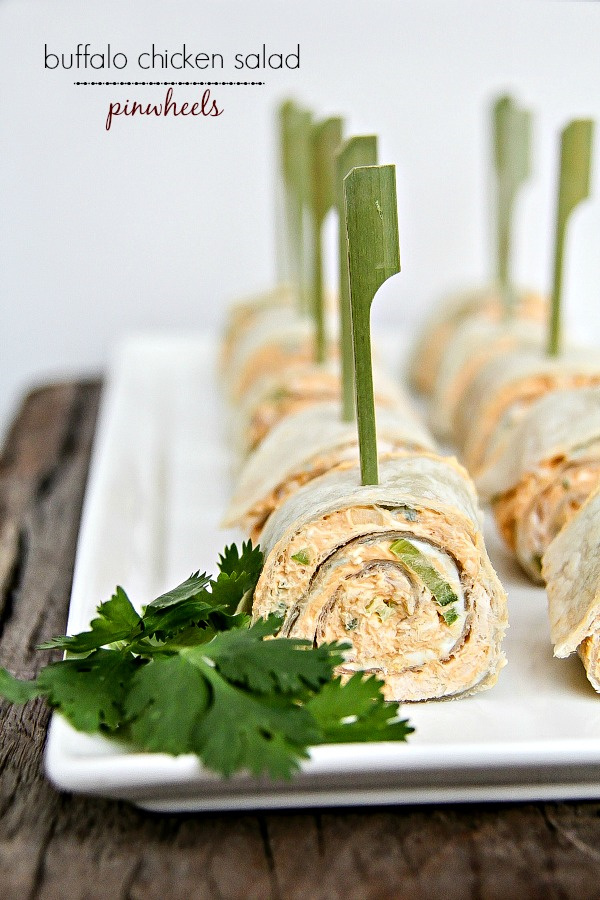 buffalo chicken salad pinwheels on a white tray