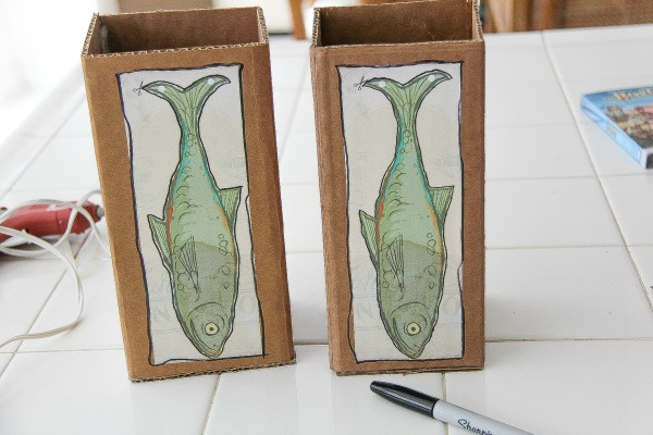 fish pictures stuck onto cardboard boxes