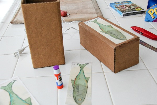 a fish printable being stuck onto a box