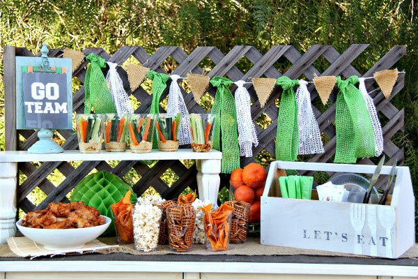 a food table set up for a football party