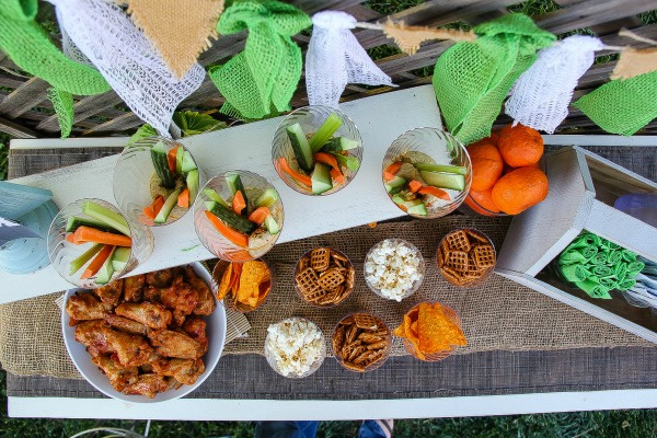 assorted snacks in clear plastic cups for a party