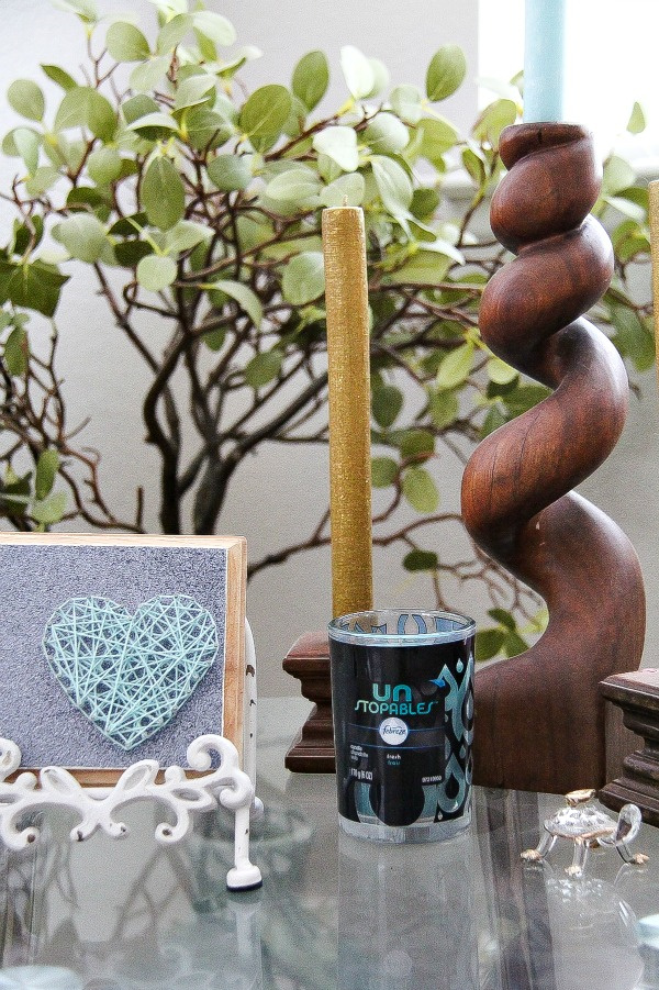 string art and candles on a table