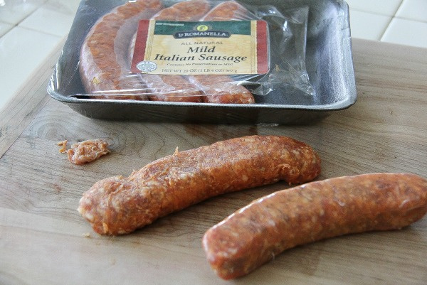 La Romanella mild italian sausages being removed from their casings