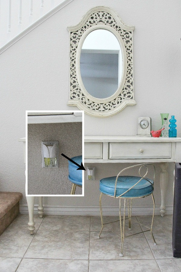 wall plug-in air freshener under a desk