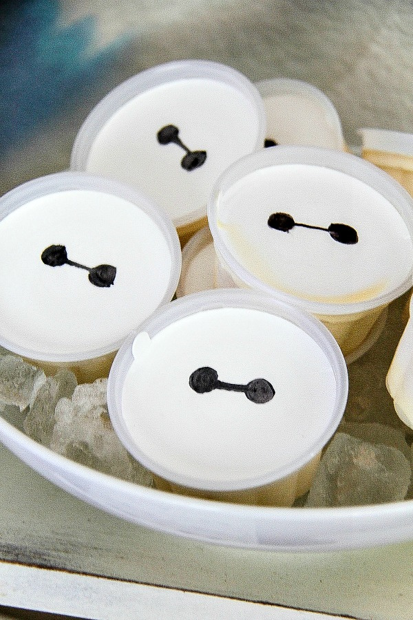 vanilla ice cream tubs with Baymax eyes drawn on