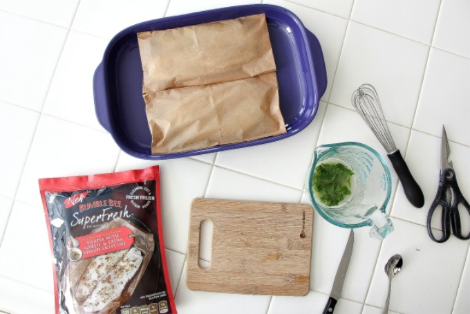 Bumble Bee fish packet and fish wrapped in brown paper in a casserole dish