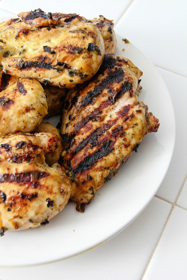 grilled chicken breasts on a white plate