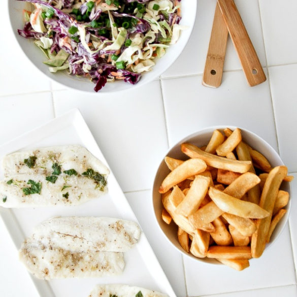 baked fish with chips and coleslaw