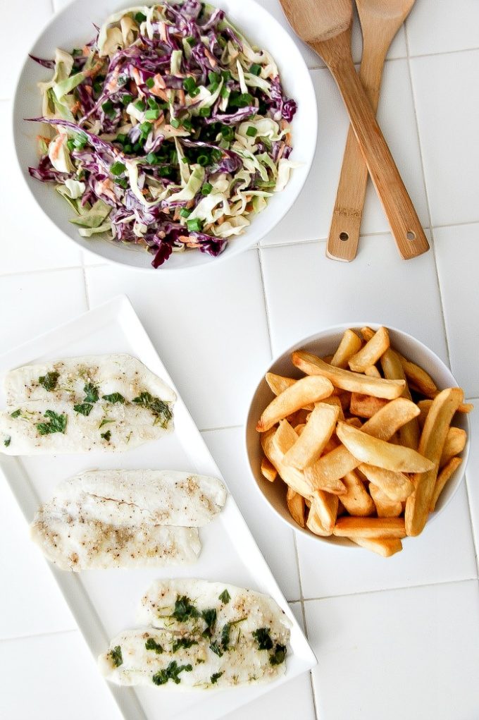 baked fish with chips and coleslaw