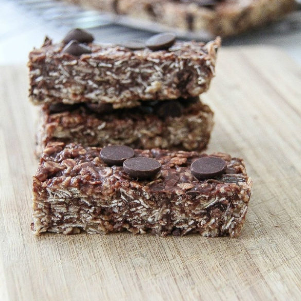 homemade granola bars cut into rectangles on a cutting board