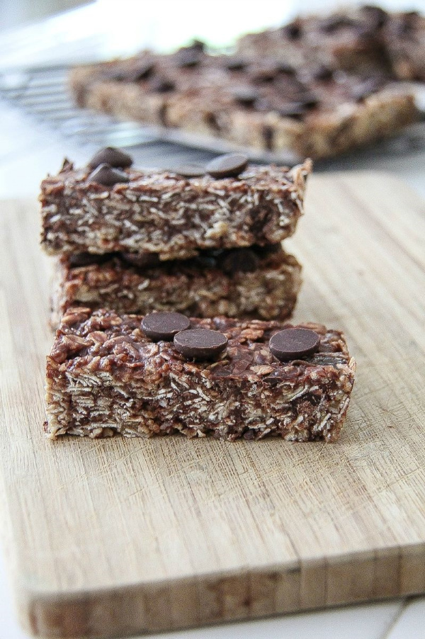 homemade granola bars cut into rectangles on a cutting board