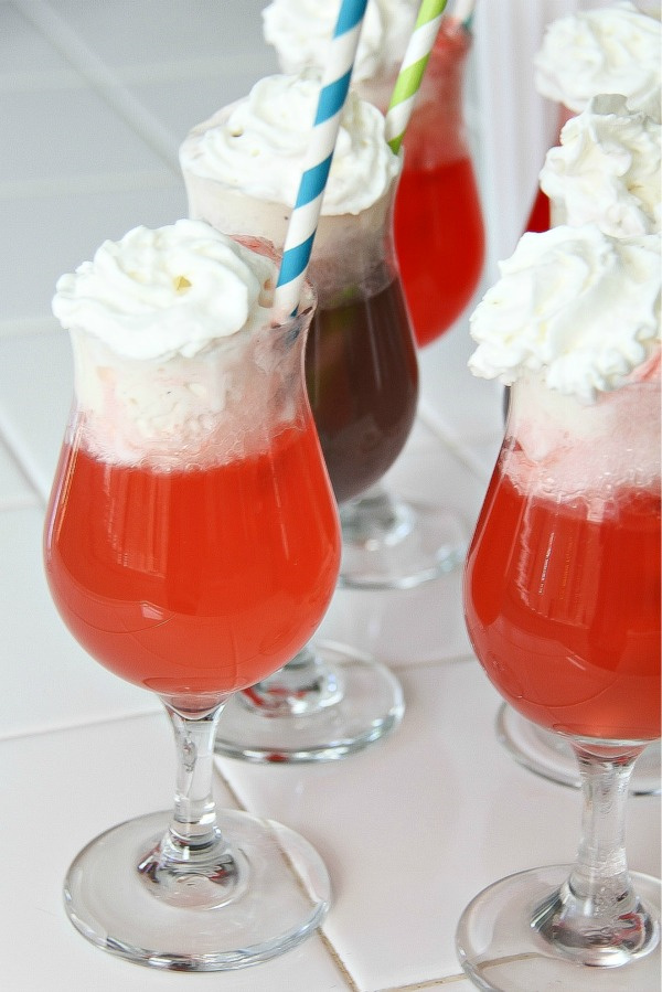 red and purple kool aid floats in a glass