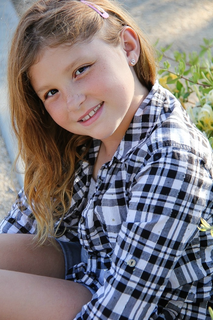 girl wearing black and white checked shirt
