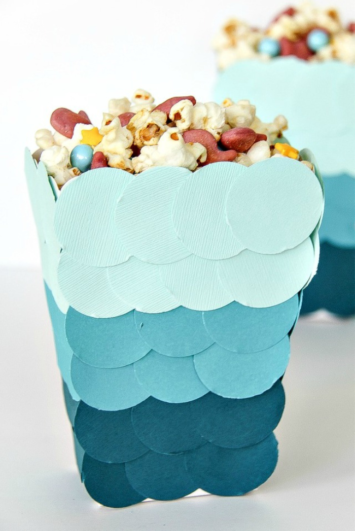 blue ombre circles on a snack tub filled with popcorn
