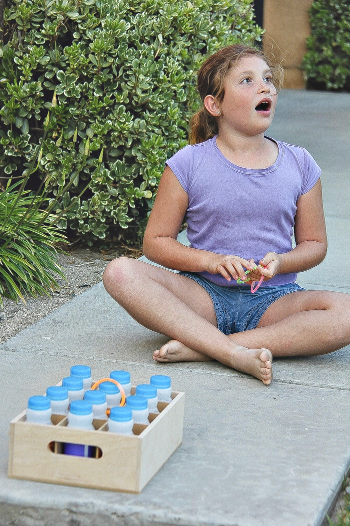 a girl playing ring toss