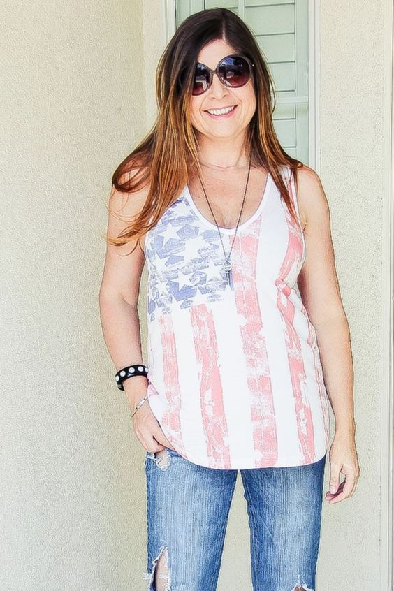 lady wearing a tank that has the american flag on it
