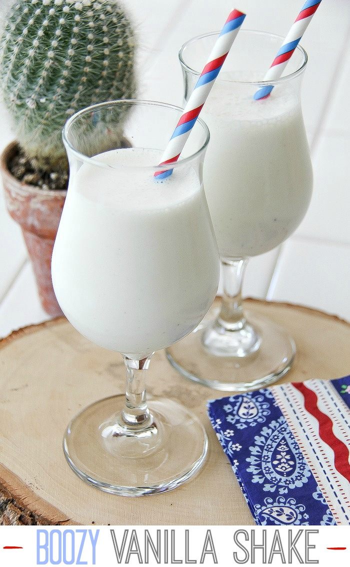 a vanilla milkshake with red white and blue straw and napkin