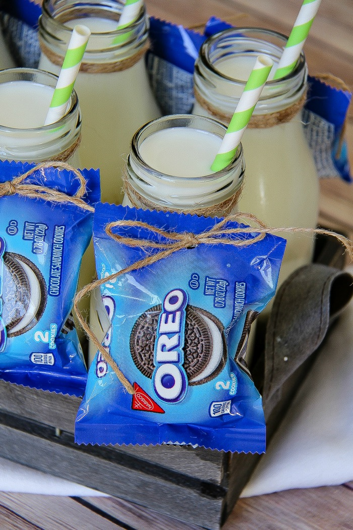 oreo packets attached to milk bottles filled with milk for kids
