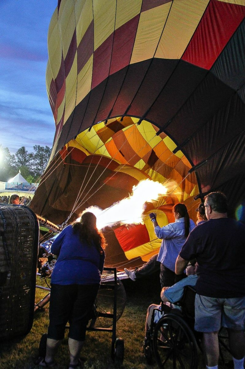 inflating of a hot air balloon after dark