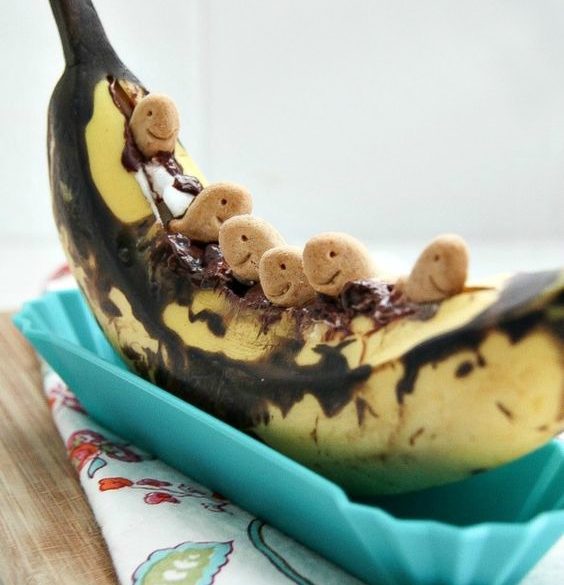 grilled banana filled with chocolate chips, marshmallows, and goldfish honey grahams