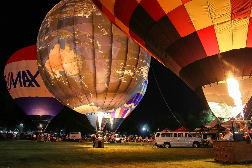 a world globe hot air balloon at night