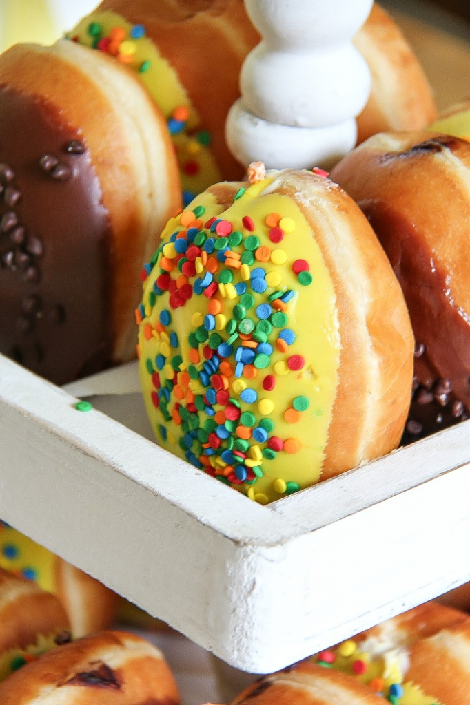 assorted donuts on a white tiered party food tray