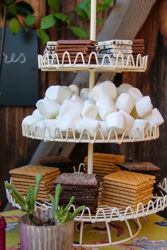 graham crackers, marshmallows, and chocolate in a cupcake stand for smores