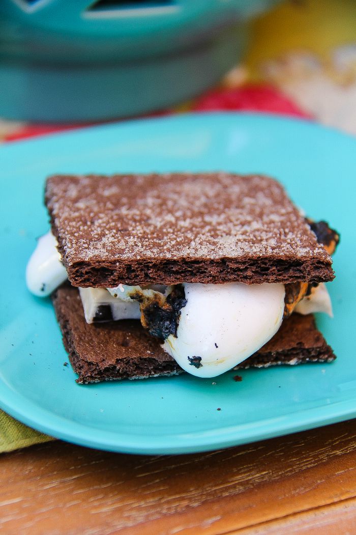 chocolate graham cracker s'mores on a blue plate