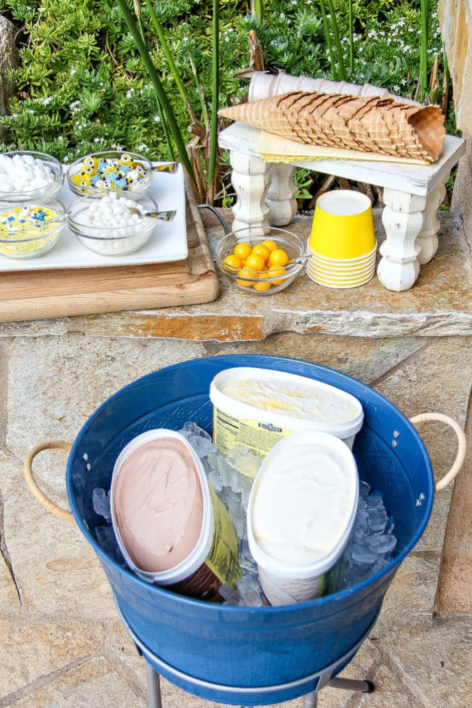 ice cream tubs and toppings for an ice cream party