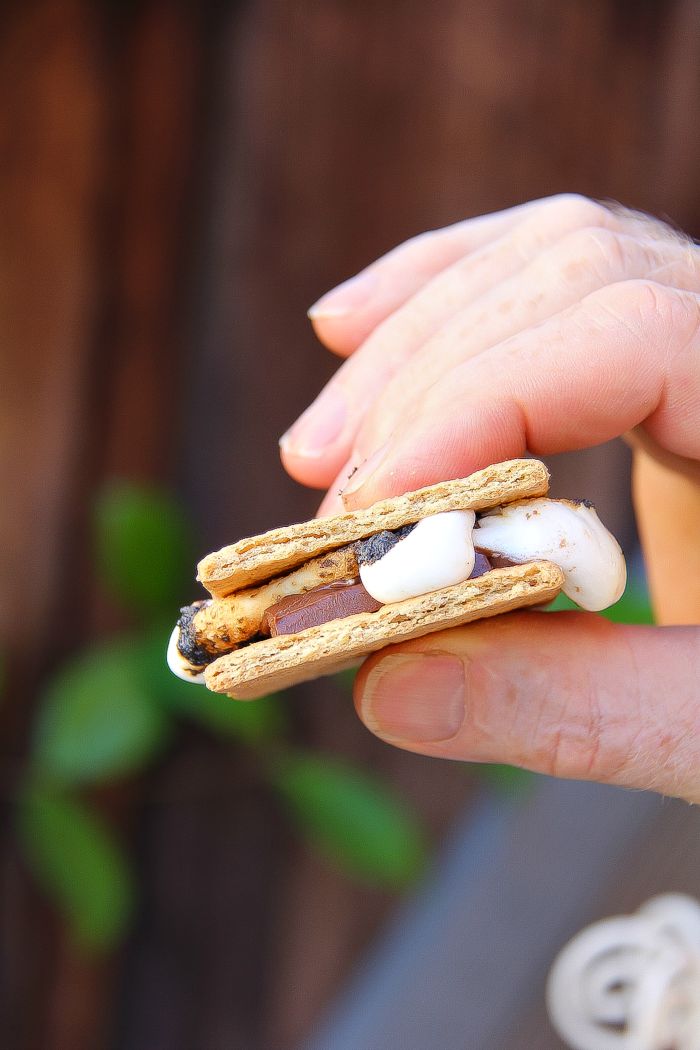 s'mores being held in a hand