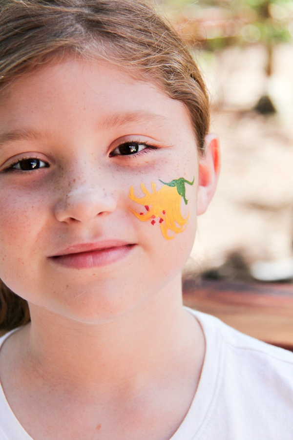 lemon lily painted on a girls face