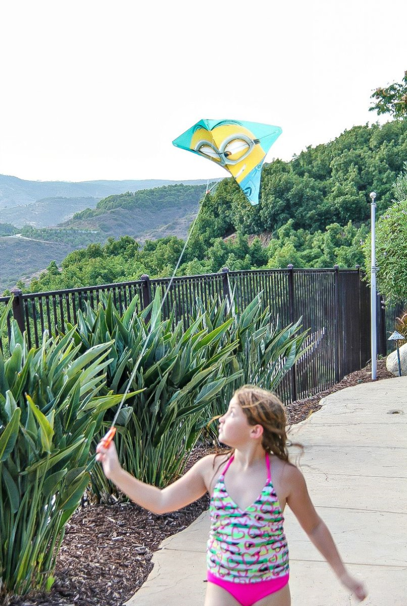 girl flying a minions kite