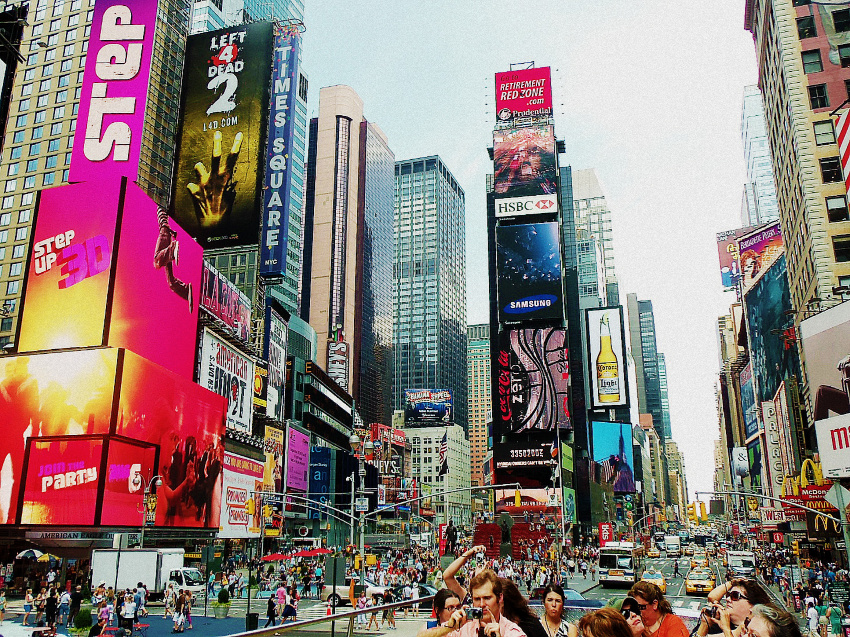 photo of new york city times square taken from the top of a tour bus