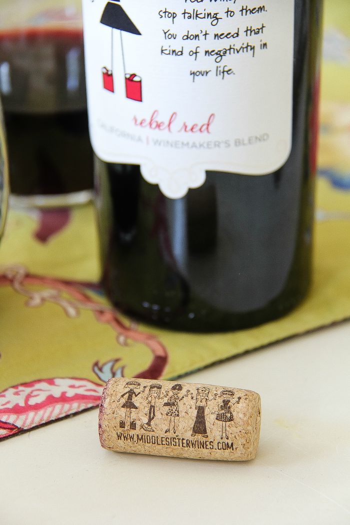 Middle Sister wine cork in front of a bottle of Middle Sister Rebel Red