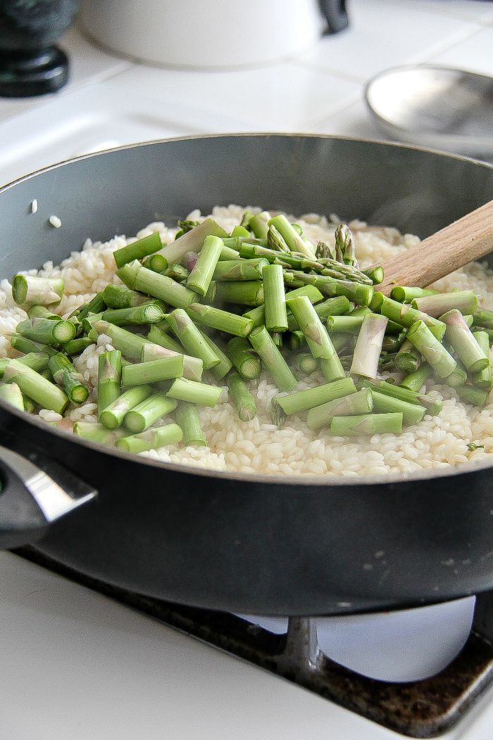 asparagus and rice in a pan to make risotto