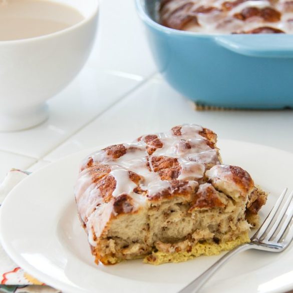 a slice of cinnamon roll casserole on a white plate