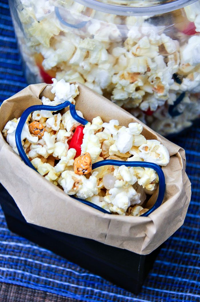 popcorn mix with candy in blue bags with the top rolled down inspired by the fantastic four