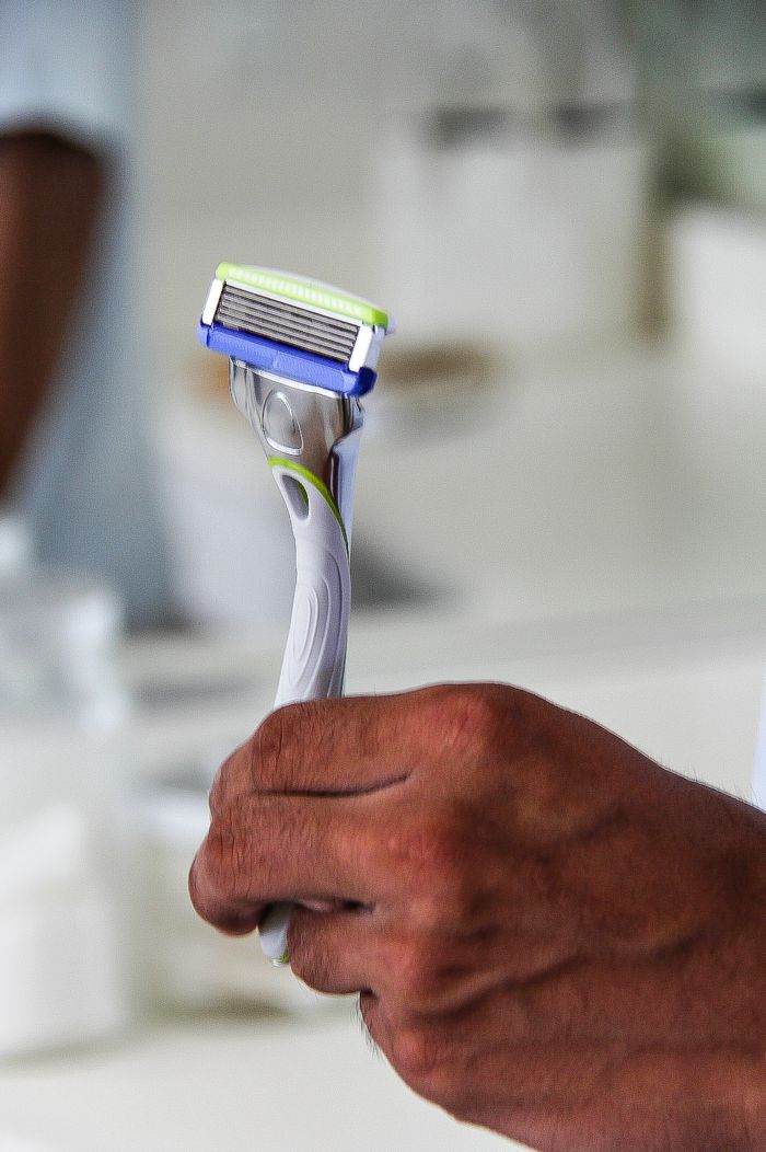 a man holding a razor