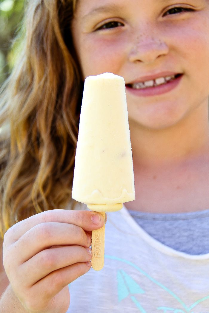 girl holding a popsicle