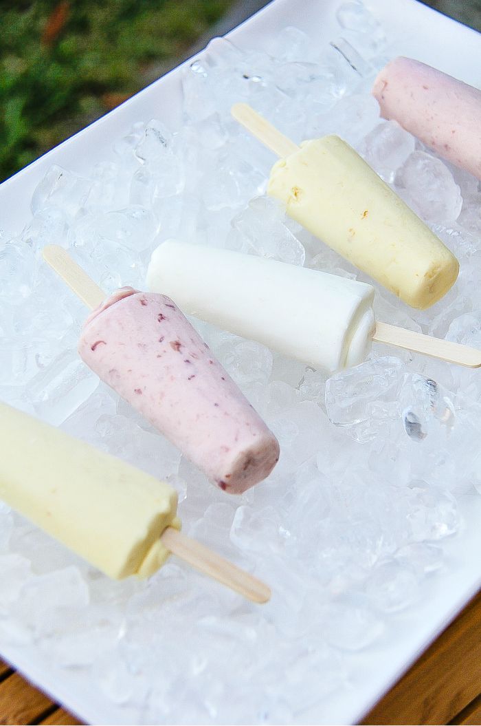 popsicles on a tray covered in ice