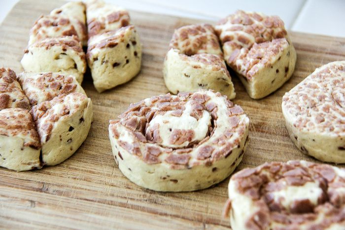 cinnamon rolls from a tube on a cutting board