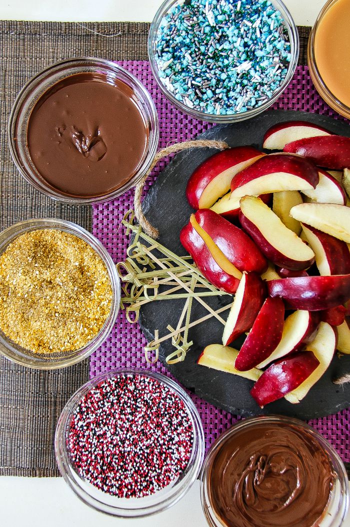 apple slices with chocolate and sprinkles