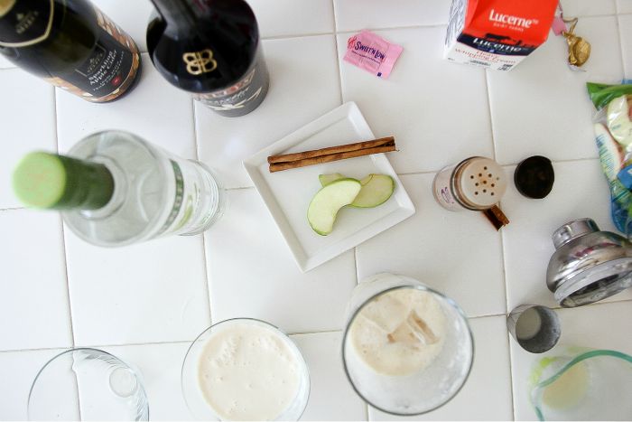 flat lay ingredients to make a cocktail with apple